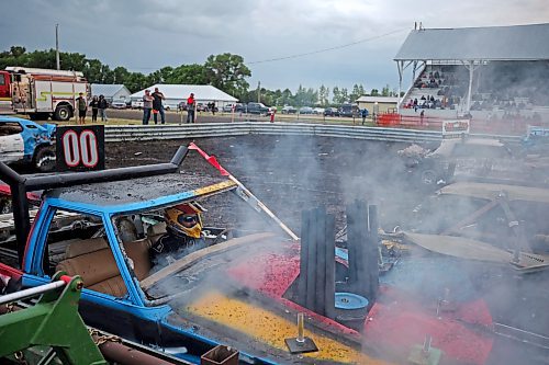 15072023
Smoke pours out of the engine of Tom Hammond&#x2019;s car during the demolition derby final at the end of the Deloraine Summer Fair on Saturday evening. Nine cars competed in the derby in front of a packed grandstand of fair-goers. 
(Tim Smith/The Brandon Sun)