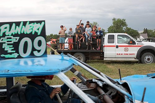 15072023
Kids watch and cheer as a competitor makes their way into the derby ring during a heat at the Deloraine Summer Fair demolition derby on Saturday evening. Nine cars competed in the derby in front of a packed grandstand of fair-goers. The event included two heats, a consolation round and a final. The fair also included a steak fry, live music, kids events, a cornhole tournament and other activities.
(Tim Smith/The Brandon Sun)
