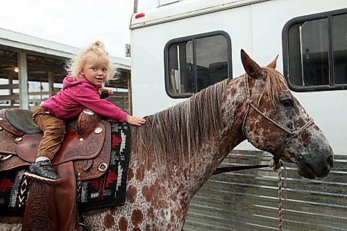 Scarlett Boese, 2, sits atop appaloosa horse Charlie during the 135th annual Strathclair Ag Society Fair on Tuesday. The Strathclair Ag Society Fair is one of six stops for the annual Milk Run, a six-day-long series of town fairs in close proximity. The other fairs include Oak River, Shoal Lake, Hamiota, Harding and Oak Lake. The Strathclair fair included a light horse show, beef show, heavy horse driving demonstration and a wide variety of entertainment, games and other activities. See more photos on Page A2. (Tim Smith/The Brandon Sun)