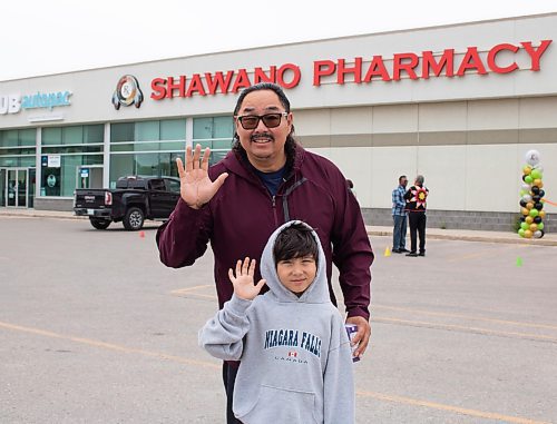 Mike Thiessen / Winnipeg Free Press 
Chief Sheldon Kent of Black River with his grandson at the grand opening of Shawano Pharmacy&#x2019;s new location on McPhillips Street. Kent is excited about the promise the endeavour has for the younger generation. For Gabrielle Piche. 230718 &#x2013; Tuesday, July 18, 2023