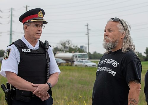 JESSICA LEE / WINNIPEG FREE PRESS

Insp. Gord Spado chats with protestor Joseph Munro July 18, 2023 after the removal of the blockade at Brady Landfill earlier that morning.

Reporter: Chris Kitching