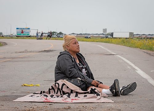 JESSICA LEE / WINNIPEG FREE PRESS

Protestor Melissa Morrisseau sits on the ground July 18, 2023 after the removal of the blockade at Brady Landfill earlier that morning.

Reporter: Chris Kitching