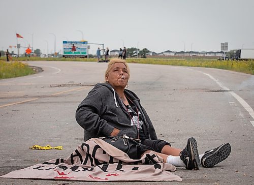 JESSICA LEE / WINNIPEG FREE PRESS

Protestor Melissa Morrisseau sits on the ground July 18, 2023 after the removal of the blockade at Brady Landfill earlier that morning.

Reporter: Chris Kitching