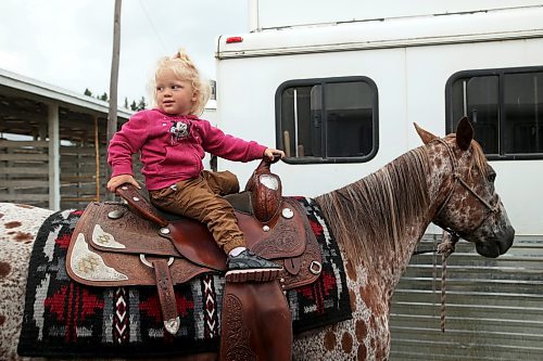 18072023
Scarlett Boese, two, sits atop appaloosa horse Charlie during the 135th Annual Strathclair Ag Society Fair on Tuesday. The Strathclair Ag Society Fair is one of six stops for the annual Milk Run, a six day long series of town fairs in close proximity. The other fairs include Oak River, Shoal Lake, Hamiota, Harding and Oak Lake. The Strathclair fair included a light horse show, a beef show, a heavy horse driving demonstration and a wide variety of entertainment, games and other activities. 
(Tim Smith/The Brandon Sun)