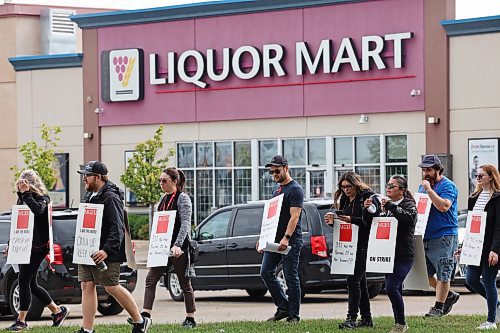Unionized Manitoba Liquor Mart employees picket outside the south end Liquor Mart in Brandon on Wednesday during a one-day province-wide strike by employees. See story on Page A3. (Tim Smith/The Brandon Sun)