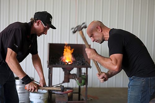 Justin Fountain and Ben Mangan with High Country Horseshoes hone their craft on Wednesday in preparation for the World Heavy Horseshoeing Championships during the 2023 World Clydesdale Show on Wednesday. (Photos by Tim Smith/The Brandon Sun)