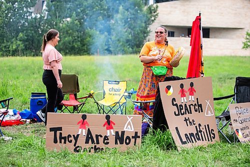 MIKAELA MACKENZIE / WINNIPEG FREE PRESS

Jorden Myran (left) and Hummingbird sing a water song at Camp Marcedes (which is by the Canadian Museum for Human Rights) on Wednesday, July 19, 2023. For Chris story.
Winnipeg Free Press 2023.