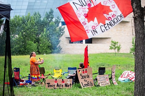 MIKAELA MACKENZIE / WINNIPEG FREE PRESS

Hummingbird (left) and Jorden Myran sing a short eagle song at Camp Marcedes (which is by the Canadian Museum for Human Rights) on Wednesday, July 19, 2023. For Chris story.
Winnipeg Free Press 2023.