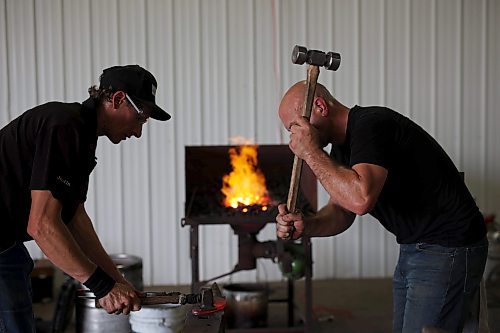19072023
Justin Fountain and Ben Mangan with High Country Horseshoes hone their craft on Wednesday in preparation for the World Heavy Horseshoeing Championships during the 2023 World Clydesdale Show at the Keystone Centre in Brandon.
(Tim Smith/The Brandon Sun)