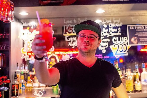 MIKAELA MACKENZIE / WINNIPEG FREE PRESS

Kelly McIvor serves up a Malibu Barbie cocktail at Club 200 on Wednesday, July 12, 2023.  For AV Kitching story.
Winnipeg Free Press 2023.