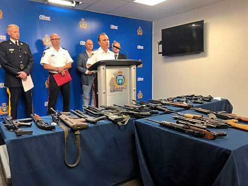 Winnipeg police Chief Danny Smyth, flanked by government and law enforcement officials, speaks about a new gun laboratory the provincial government is funding at WPS headquarters. ERIK PINDERA/WINNIPEG FREE PRESS