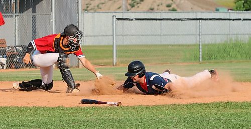 RFNOW Cardinals base runner Shayne MacGranachan slides safely into the plate in the first inning as Cubs catcher Dylan Schrader attempts to tag him during Andrew Agencies Senior AA Baseball League semifinal action at Sumner Field on Thursday. (Perry Bergson/The Brandon Sun)
