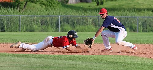 Cubs base runner JT Martine dives safely back into second base as RFNOW Cardinals shortstop Buddy Mayert prepares to catch the ball during Andrew Agencies Senior AA Baseball League semifinal action at Sumner Field on Thursday. (Photos by Perry Bergson/The Brandon Sun)