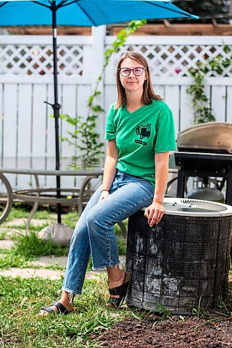 MIKAELA MACKENZIE / WINNIPEG FREE PRESS

Bethany Daman, who works on climate advocacy in Manitoba and has seen the impacts of extreme heat in her neighbourhood, with the air conditioning unit at her home in Winnipeg on Thursday, July 20, 2023. For JS Rutgers story.
Winnipeg Free Press 2023