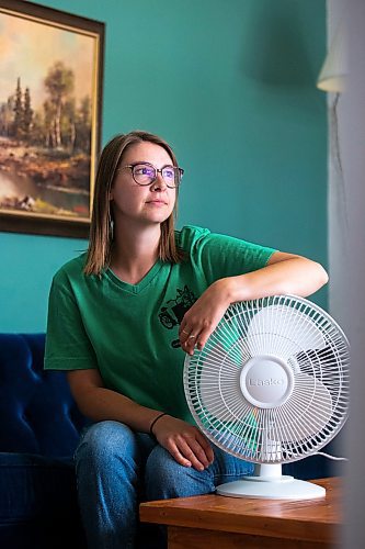 MIKAELA MACKENZIE / WINNIPEG FREE PRESS

Bethany Daman, who works on climate advocacy in Manitoba and has seen the impacts of extreme heat in her neighbourhood, at her home in Winnipeg on Thursday, July 20, 2023. For JS Rutgers story.
Winnipeg Free Press 2023