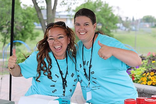 Volunteers Eliana Osorio and Emilie Cox man the mocktail lounge during the opening day of Brandon’s first Salamander Summer Music Festival at Rideau Park. (Kyle Darbyson/The Brandon Sun) 