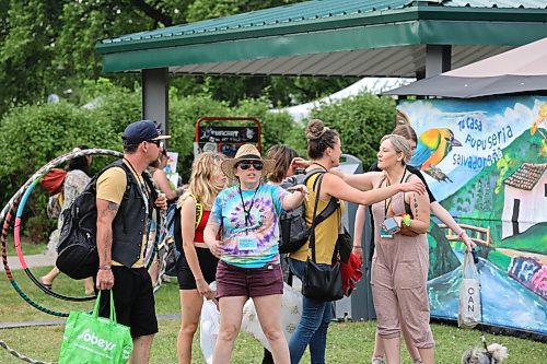 Some local music lovers enter Rideau Park Friday evening to take part in the first ever Salamander Summer Music Festival. (Kyle Darbyson/The Brandon Sun)