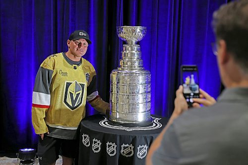 21072023
Dale Woloshyn has his photo taken with the Stanley Cup during a public event with the trophy and Vegas Golden Knights general manager Kelly McCrimmon at the Keystone Centre on Friday. McCrimmon had the trophy in Brandon for the whole day, bringing it to a series of public and private events. Thousands lined up throughout the morning to see the cup up close and meet with McCrimmon. (Tim Smith/The Brandon Sun)