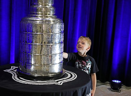 21072023
Zander Hebert looks at the Stanley Cup during a public event with the trophy and Vegas Golden Knights general manager Kelly McCrimmon at the Keystone Centre on Friday. McCrimmon had the trophy in Brandon for the whole day, bringing it to a series of public and private events. Thousands lined up throughout the morning to see the cup up close and meet with McCrimmon. (Tim Smith/The Brandon Sun)