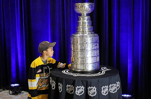 21072023
Logan Ding takes a close look at the Stanley Cup during a public event with the trophy and Vegas Golden Knights general manager Kelly McCrimmon at the Keystone Centre on Friday. McCrimmon had the trophy in Brandon for the whole day, bringing it to a series of public and private events. Thousands lined up throughout the morning to see the cup up close and meet with McCrimmon. (Tim Smith/The Brandon Sun)