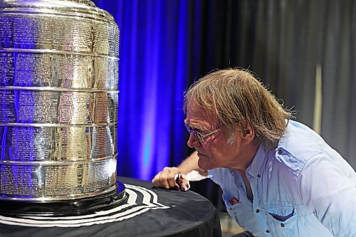 21072023
Bill Roseveare takes a close look at the Stanley Cup during a public event with the trophy and Vegas Golden Knights general manager Kelly McCrimmon at the Keystone Centre on Friday. McCrimmon had the trophy in Brandon for the whole day, bringing it to a series of public and private events. Thousands lined up throughout the morning to see the cup up close and meet with McCrimmon. (Tim Smith/The Brandon Sun)