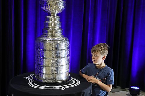 21072023
Kade Hebert looks at the Stanley Cup during a public event with the trophy and Vegas Golden Knights general manager Kelly McCrimmon at the Keystone Centre on Friday. McCrimmon had the trophy in Brandon for the whole day, bringing it to a series of public and private events. Thousands lined up throughout the morning to see the cup up close and meet with McCrimmon. (Tim Smith/The Brandon Sun)