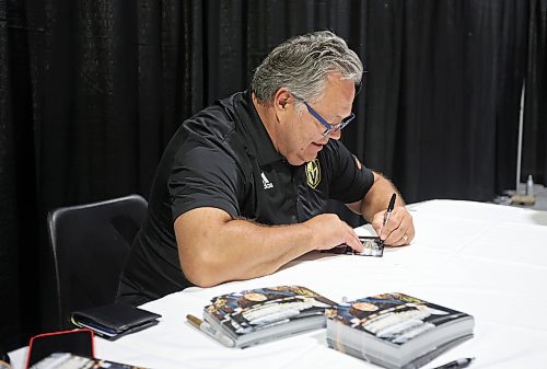 21072023
Vegas Golden Knights' general manager and former Brandon Wheat Kings owner, general manager and coach Kelly McCrimmon signs autograph&#x2019;s for hockey fans at the Keystone Centre on Friday morning during a public event with the Stanley Cup trophy. McCrimmon had the trophy in Brandon for the whole day, bringing it to a series of public and private events. Thousands lined up throughout the morning to see the cup up close and meet with McCrimmon. (Tim Smith/The Brandon Sun)