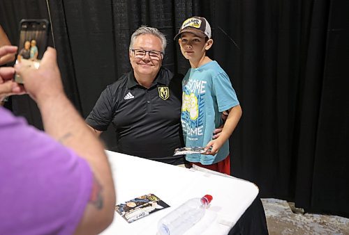 21072023
Vegas Golden Knights' general manager and former Brandon Wheat Kings owner, general manager and coach Kelly McCrimmon takes a photo with fan Jordan Swain at the Keystone Centre on Friday morning during a public event with the Stanley Cup trophy. McCrimmon had the trophy in Brandon for the whole day, bringing it to a series of public and private events. Thousands lined up throughout the morning to see the cup up close and meet with McCrimmon. (Tim Smith/The Brandon Sun)