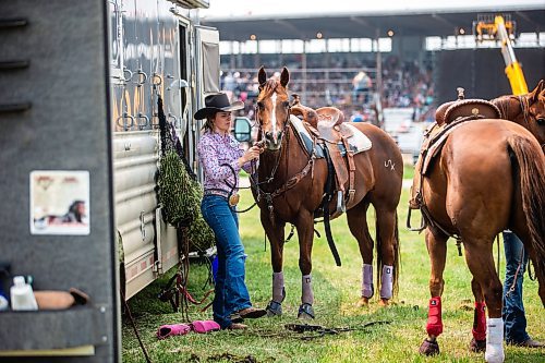 MIKAELA MACKENZIE / WINNIPEG FREE PRESS

Brooke Wills, from Dawson Creek, gets her horse ready for the barrel racing event at the Manitoba Stampede in Morris on Saturday, July 22, 2023. For Tyler story.
Winnipeg Free Press 2023