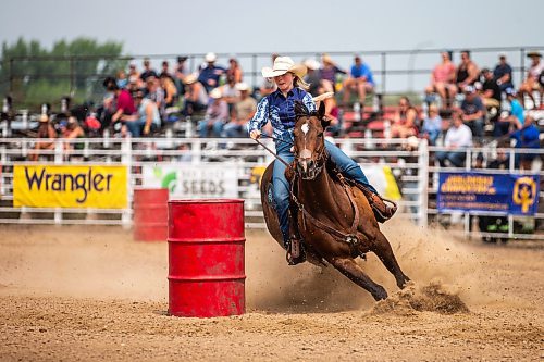 MIKAELA MACKENZIE / WINNIPEG FREE PRESS

Quincy Squair whips around a corner during the ladies barrel racing event at the Manitoba Stampede in Morris on Saturday, July 22, 2023. For Tyler story.
Winnipeg Free Press 2023