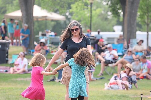 Christine Penner dances along with some family friends at Rideau Park on Saturday afternoon. Penner is a member of the Flamenco on the Prairies dance group and was scheduled to perform at Rideau during the final day of the Salamander Summer Music Festival. (Kyle Darbyson/The Brandon Sun)
