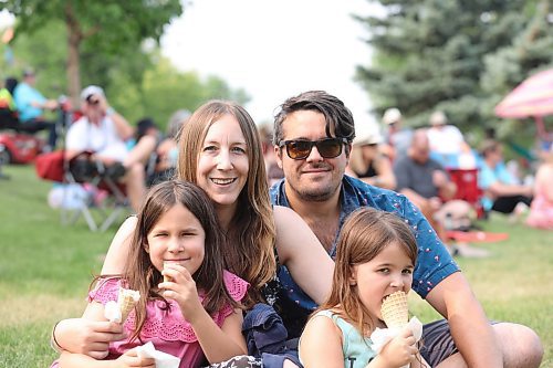 The Gazzola family, consisting of Hannah, Ashley, Mike and Isla, enjoy some live music and ice cream during the second day of the festival. (Kyle Darbyson/The Brandon Sun)