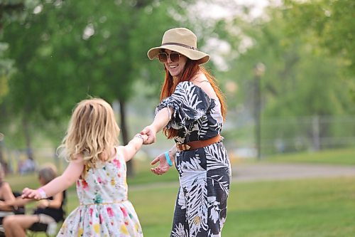 Lavender Read dances with her daughter Isla at Rideau Park Saturday afternoon as the reggae-inspired band Lyon-I performs in the background. The inaugural Salamander Summer Music Festival showcased a variety of Manitoba musical talent during its second day, including Full Flannel Jacket, the Michelle Boudreau Band and Vertigo/Matt Cory Band. (Kyle Darbyson/The Brandon Sun)