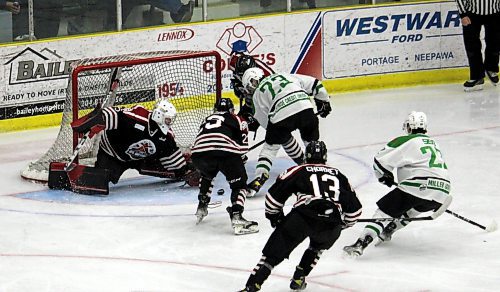 Virden Oil Capitals netminder Owen Larcoque turns aside Portage Terriers forward during Game 7 of their Manitoba Junior Hockey League semifinal series at Stride Place on April 19. (Lucas Punkari/The Brandon Sun)