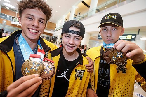 JOHN WOODS / WINNIPEG FREE PRESS
Hayden Bowman U16 swimming from left, Austin Bowman U14 swimming, and Riley Anderson U16 swimming are photographed as they return from the North American Indigenous Games in Halifax at Winnipeg&#x2019;s airport, Sunday, July 23, 2023. 

Reporter: ?