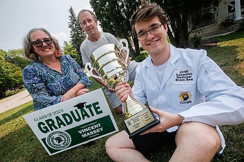 JOHN WOODS / WINNIPEG FREE PRESS
Mark Piasecki and parents Jennifer and Paul are photographed outside their house in Winnipeg, Monday, July 24, 2023. Piasecki was named the 2023 Canadian National Brain Bee champion and will represent Canada against 40 other nations in the International Brain Bee competition in Washington next month. The Brain Bee is a neuroscience competition for teens.

Reporter: graham