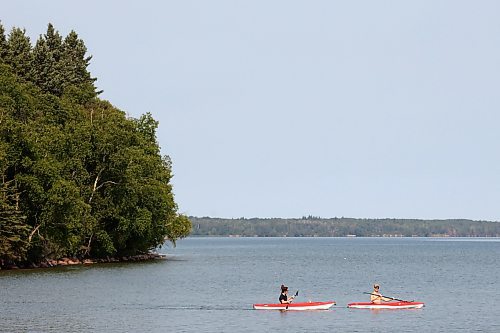 24072023
Kayakers paddle through the water at Clear Lake in Riding Mountain National Park on a hot Monday. (Tim Smith/The Brandon Sun)