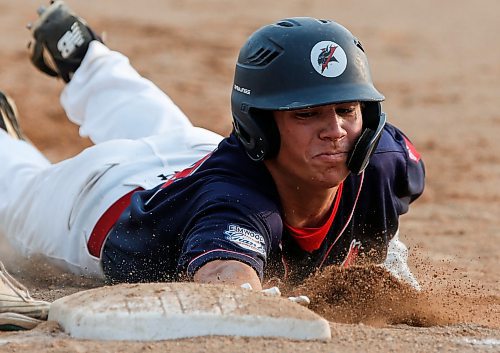 JOHN WOODS / WINNIPEG FREE PRESS
Elmwood Giants&#x2019; Brett Lucko (40) beats the throw to first against the St Boniface Legionaires in game one of the best of five MJBL championship series at Koskie Field in Winnipeg, Monday, July 24, 2023. 

Reporter: frey-sam
