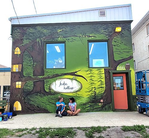 Katy Martin and Meaghan Peters, local Neepawa artists, painted murals on the inside and outside of new toy store Hid'n Hollow, located at 266 Davidson Street. (Miranda Leybourne/The Brandon Sun)