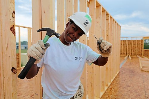Anita Onifade, a Habitat for Humanity home-owner-to-be, poses for a photo at the Women Build construction site on the 700 Block of Franklin Street in Brandon on Tuesday. For a story on the project, turn to Page A3. (Michele McDougall/The Brandon Sun)