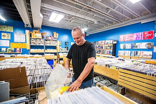 MIKAELA MACKENZIE / WINNIPEG FREE PRESS

Cavin Borody, owner of Winnipeg Record &amp; Tape Co, in his shop on Monday, July 24, 2023. Cavin is celebrating the 10th anniversary of the store, which stocks the city's largest selection of soul, R&amp;B, disco &amp; funk music. For Dave Sanderson story.
Winnipeg Free Press 2023