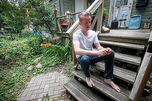 JOHN WOODS / WINNIPEG FREE PRESS
Nathan Enns, prop master in the Manitoba film industry, whittles on his front deck in Winnipeg, Tuesday, July 25, 2023. The industry strike in the US seems to be indirectly affecting the Manitoba film industry. Manitoba&#x2019;s film production has ground to a halt.

Reporter: ?