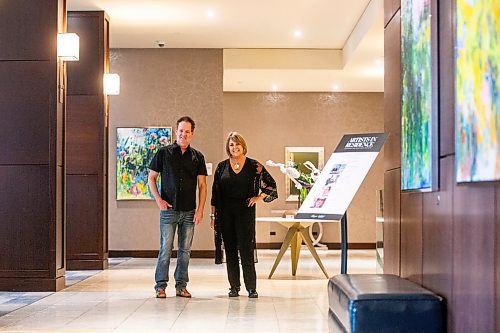 MIKAELA MACKENZIE / WINNIPEG FREE PRESS

Fairmont artists-in-residence Charlie Johnston (sculptor, left) and Amanda Onchulenko (painter) with their work in the hotel lobby in Winnipeg on Tuesday, July 25, 2023. For Al Small story.
Winnipeg Free Press 2023