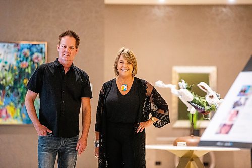 MIKAELA MACKENZIE / WINNIPEG FREE PRESS

Fairmont artists-in-residence Charlie Johnston (sculptor, left) and Amanda Onchulenko (painter) with their work in the hotel lobby in Winnipeg on Tuesday, July 25, 2023. For Al Small story.
Winnipeg Free Press 2023