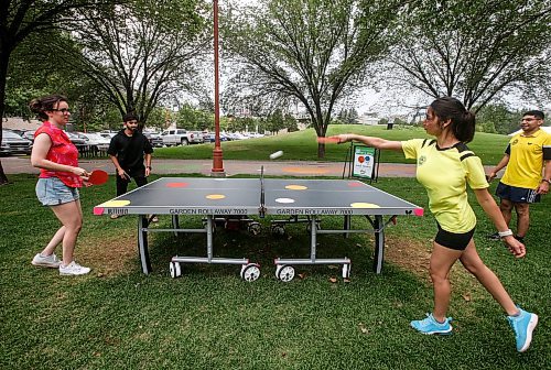 JOHN WOODS / WINNIPEG FREE PRESS
Jaspreet Kaur and Carlos Cuadra, executive director of the Manitoba Table Tennis Association (MTTA), right, play Elizabeth Jones and Amin Mukhida at the Forks in Winnipeg, Tuesday, July 25, 2023. The MTTA gives demonstrations, instruction and playing opportunities every Tuesday evening until September.

Reporter: standup