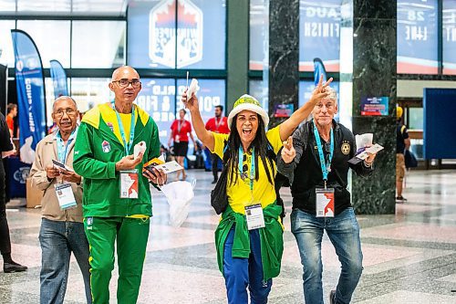 MIKAELA MACKENZIE / WINNIPEG FREE PRESS

Brazilians Ranes Costa (left), Antonio Josias, Marcia Valeria, and Marco Barritano walk to the World Police and Fire Games registration at the at the RBC Convention Centre on Wednesday, July 26, 2023. Standup.
Winnipeg Free Press 2023