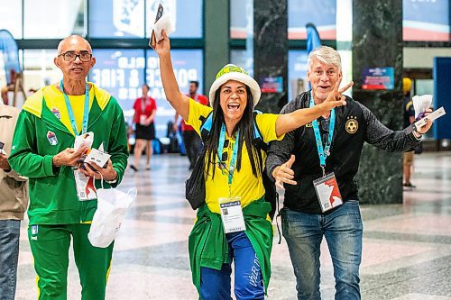 MIKAELA MACKENZIE / WINNIPEG FREE PRESS

Brazilians Antonio Josias (left), Marcia Valeria, and Marco Barritano walk to the World Police and Fire Games registration at the at the RBC Convention Centre on Wednesday, July 26, 2023. Standup.
Winnipeg Free Press 2023