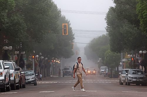 26072023
A pedestrian crosses Rosser Avenue in downtown Brandon on a foggy Wednesday morning. (Tim Smith/The Brandon Sun)