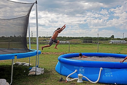 26072023
Zachary Beardy leaps into a pool while swimming with friends on his seventh birthday at Sioux Valley Dakota Nation on a scorching hot Wednesday afternoon. (Tim Smith/The Brandon Sun)