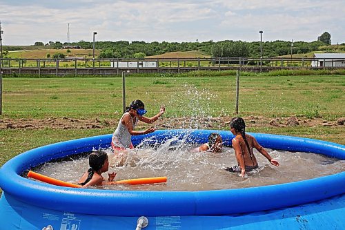 26072023
Dimitrius Beardy, Maddison Hall, Prairie Wasicuna and Zachary Beardy swim together on Zachary&#x2019;s seventh birthday at Sioux Valley Dakota Nation on a scorching hot Wednesday afternoon. (Tim Smith/The Brandon Sun)